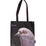 Dinosaur Tote front, with big pigeon head, "Dinosaur" and artist Iván Argote's signature screen-printed on a black tote.