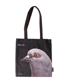 Dinosaur Tote front, with big pigeon head, "Dinosaur" and artist Iván Argote's signature screen-printed on a black tote.