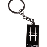 Enamel keychain with the High Line railroad-track "H" icon and "Park in the Sky, New York NY" in all caps.