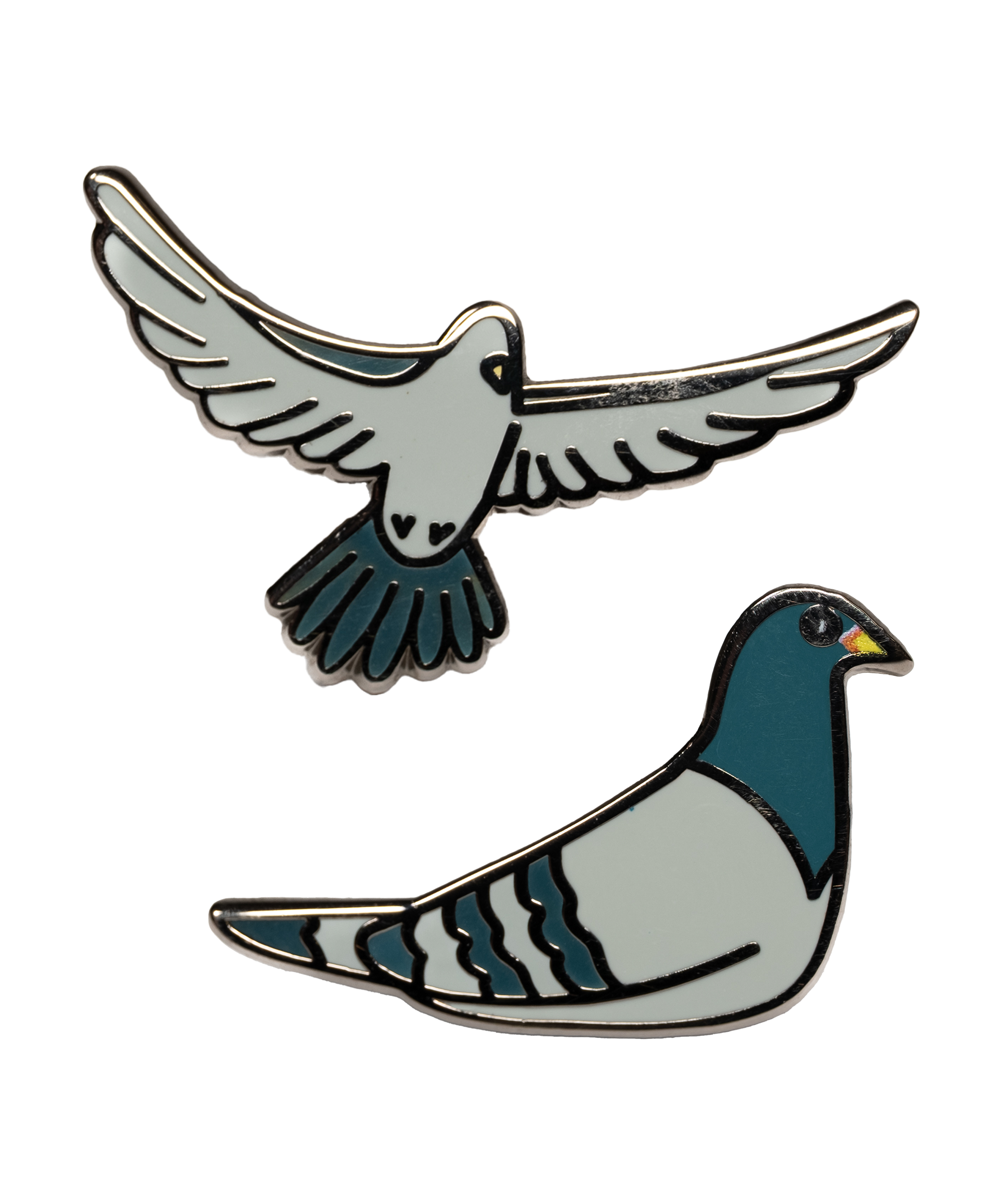 The Pigeon Pins—two enamel pigeon pins, one sitting and one in flight, illustrated by Jiaqi Wang.