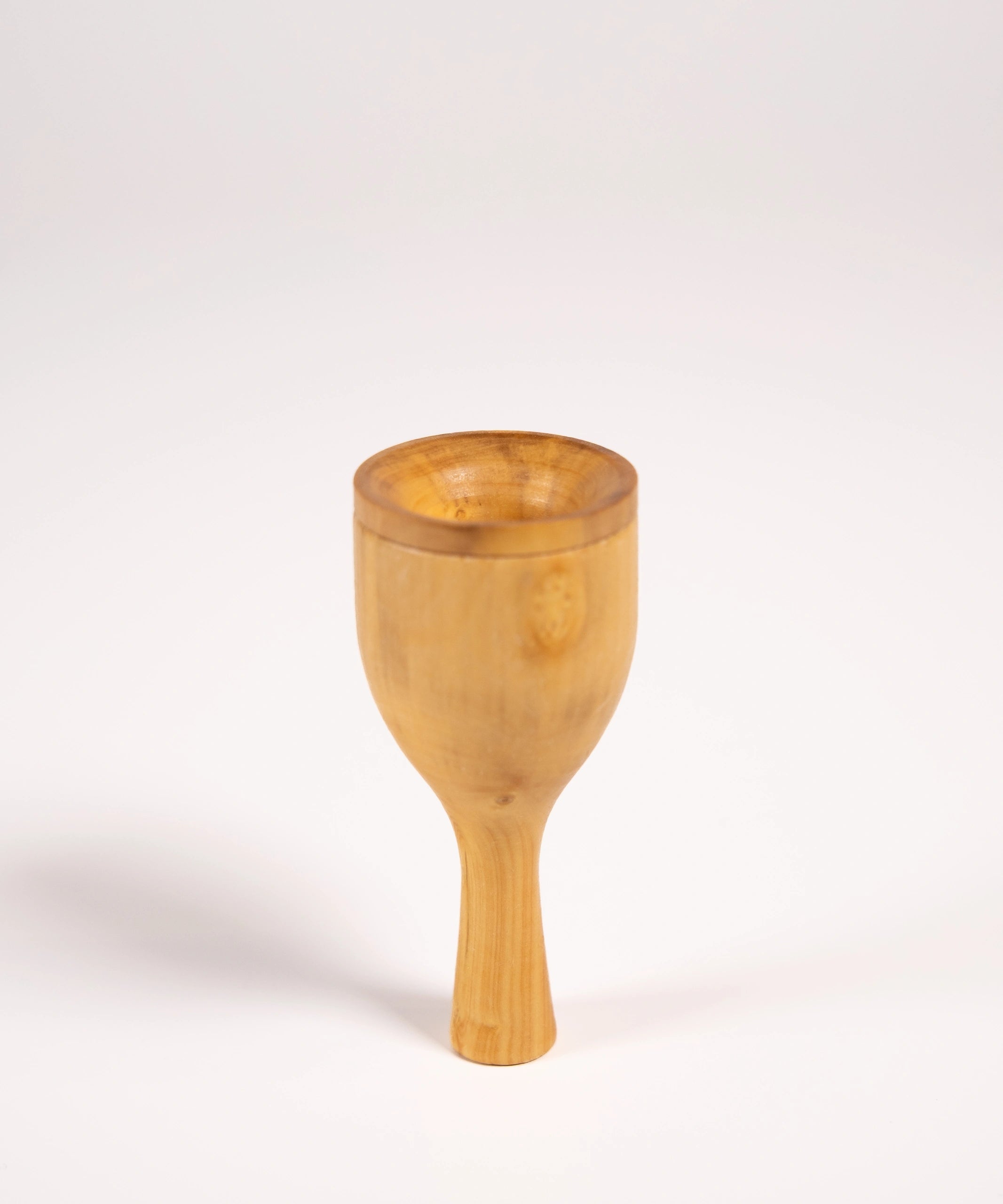 Robin bird call made from wood and metal against a white background.