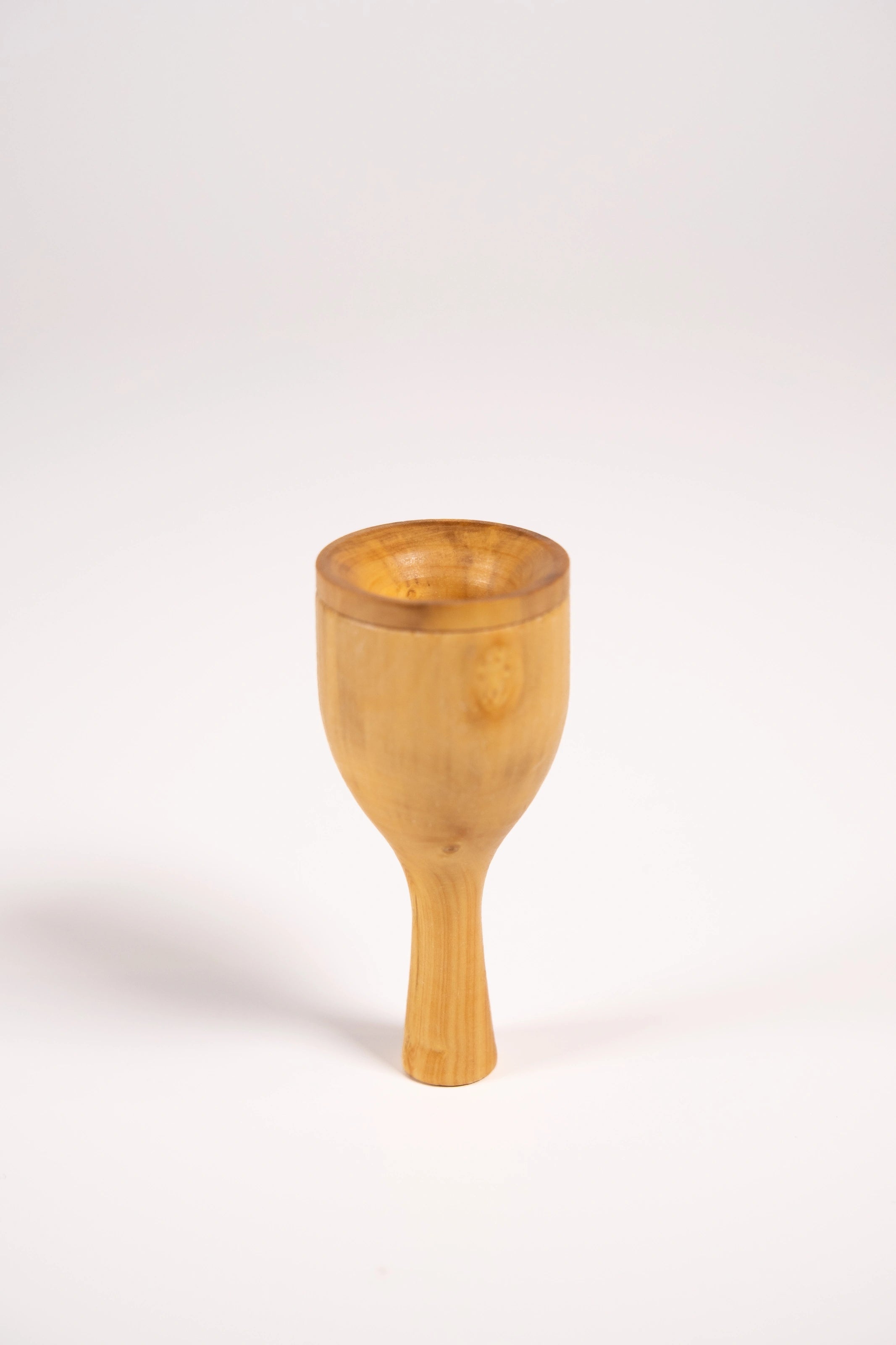 Robin bird call made from wood and metal against a white background.