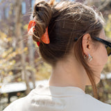 Closeup of the Big Icon Crewneck in River Birch with monochromatic "Park in the Sky" embroidered below the back collar.