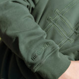 Big Icon Crewneck in Ivy with monochromatic embroidery details. Front features big High Line icon and High Line wordmark on sleeve. Close-up on embroidery details.