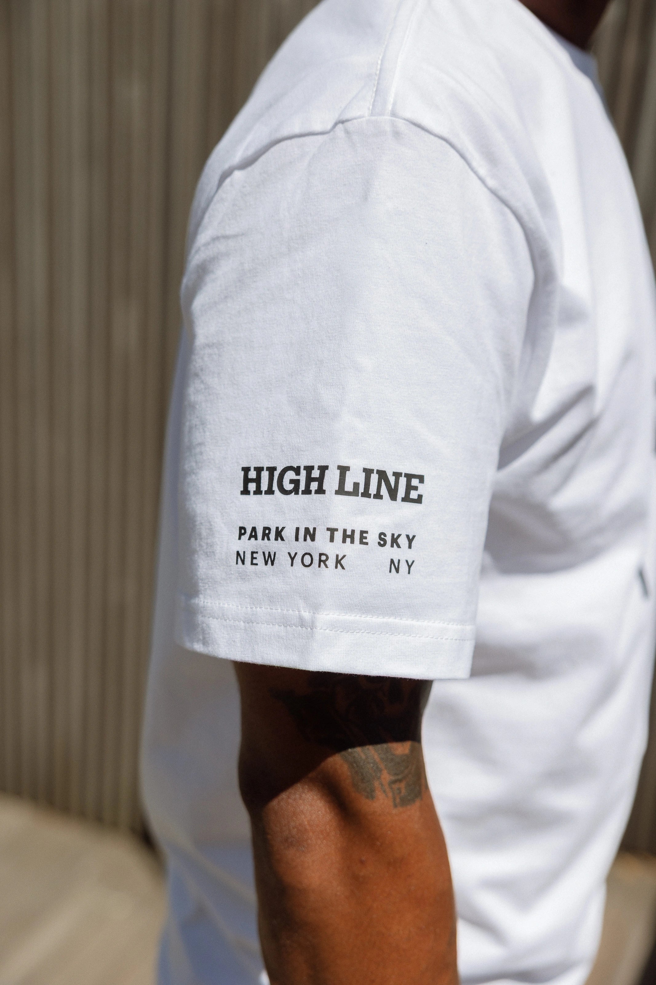 Detail of sleeve on Big Icon Tee in White.