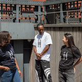 Three people, all in Big Icon Tees, laughing with each other.