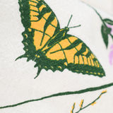 Illustrated butterfly amidst the flora on the Claudia Pearson x High Line Chelsea Grassland tea towel. 