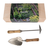 Sneeboer trowel and hand hoe with High Line icon and "Piet Oudolf collection" embossed on the wood handles. They come in a wood box, also embossed with piet oudolf collection and wrapped with an image of the High Line.