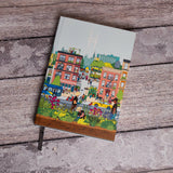 Community in the Sky Notebook featuring Jiaqi Wang's Nature in the City illustration and the High Line icon against a bench.