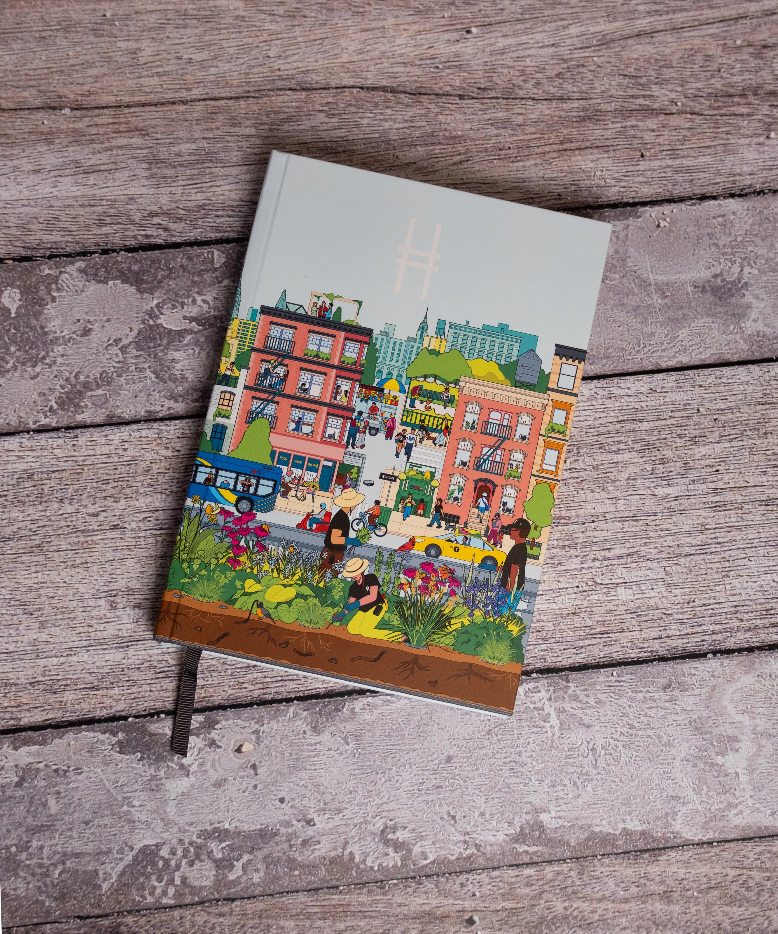 Community in the Sky Notebook featuring Jiaqi Wang's Nature in the City illustration and the High Line icon against a bench.