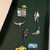 The Community in the Sky enamel pin collection on the Park in the Sky Tote in Ivy.