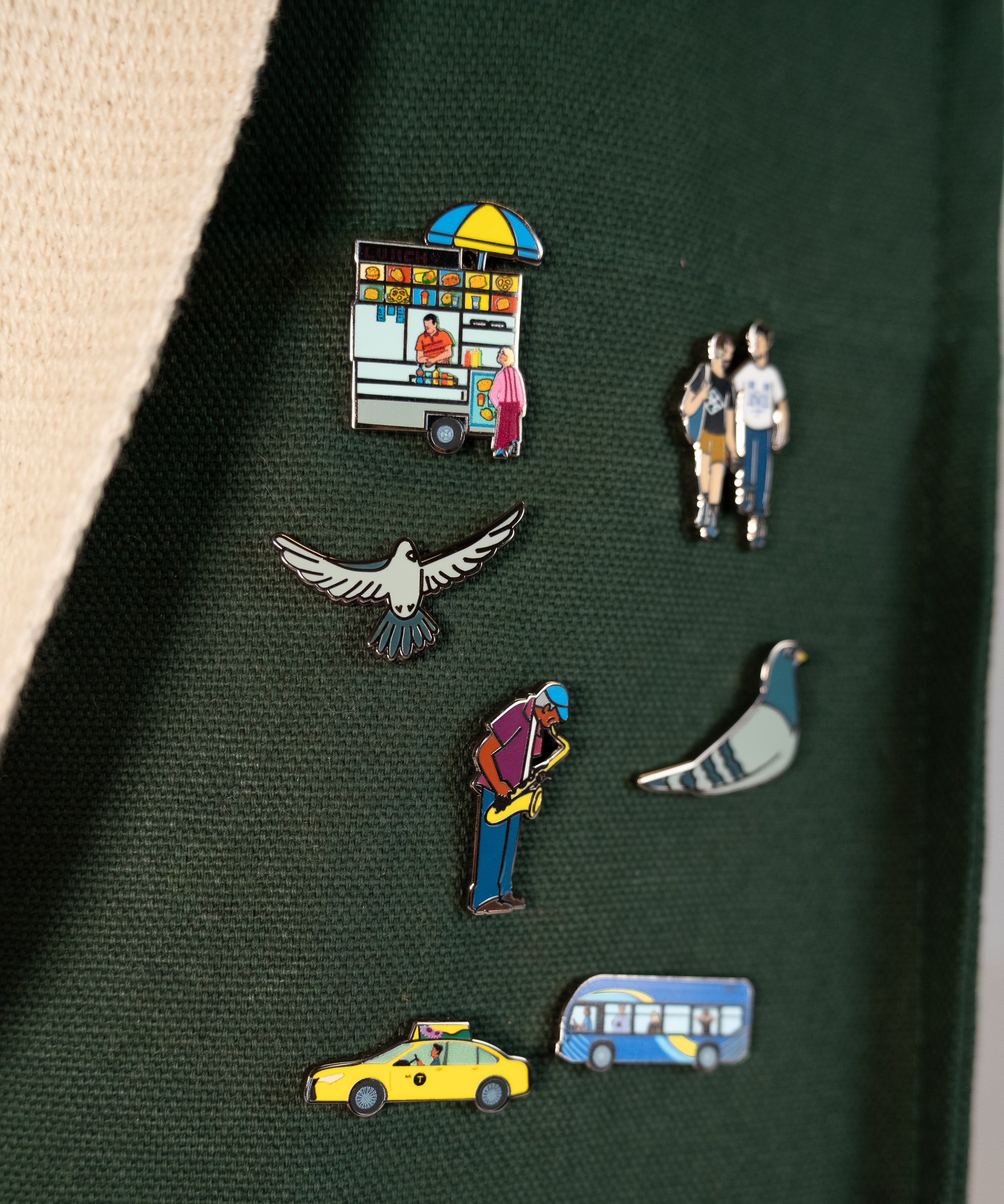 The Community in the Sky enamel pin collection on the Park in the Sky Tote in Ivy.