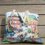 Community in the Sky Tote, featuring the Nature in the City mural illustrated by Jiaqi Wang, leaning on one of the sun deck loungers on the High Line.