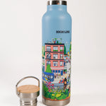 Stainless steel water bottle with a colorful design and 'High Line' branding on a blue background with wooden lid. Lid is off and next to the bottle.