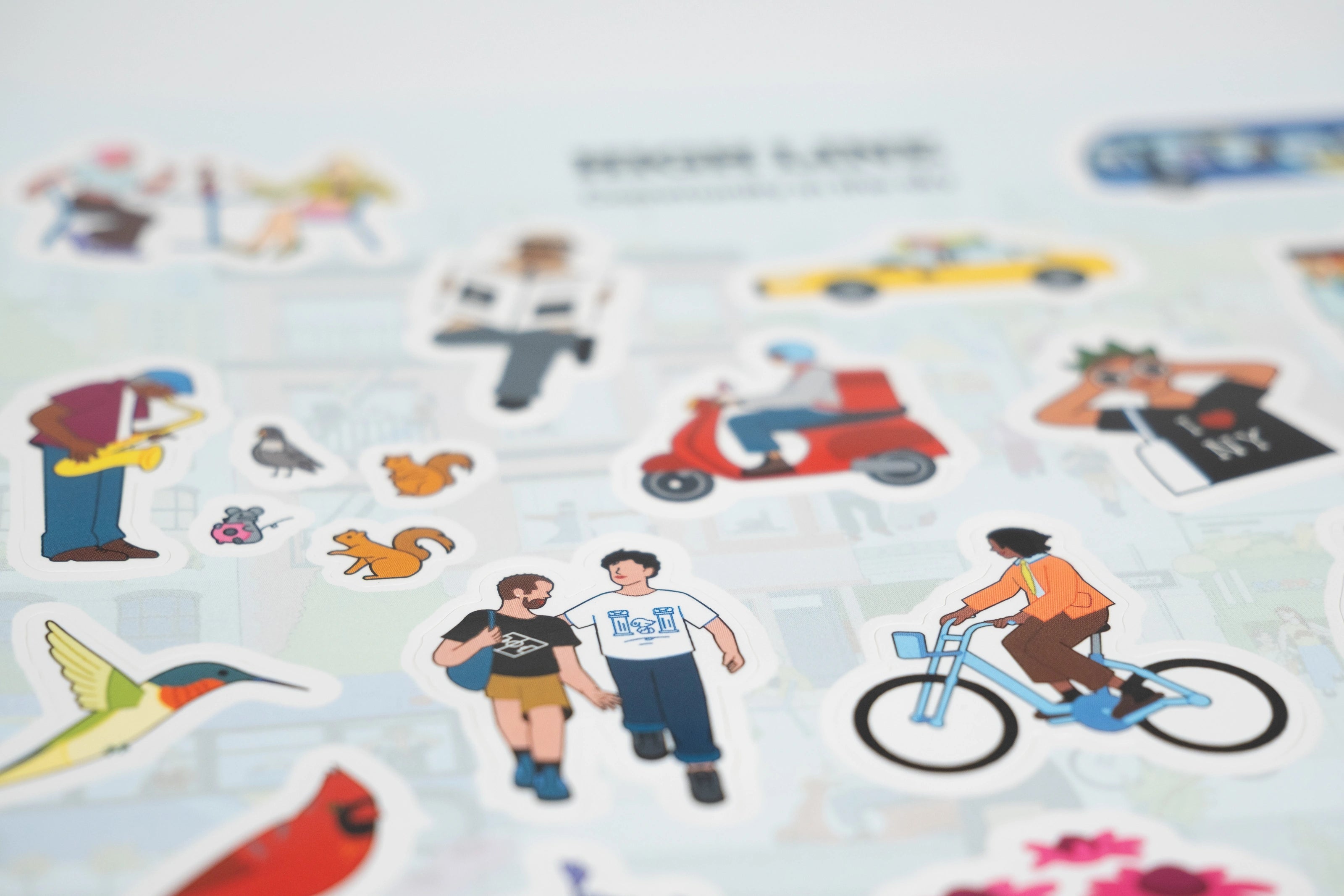 Closeup of the Community in the Sky sticker sheet featuring 26 of Jiaqi Wang's illustrations from the Nature in the City mural.