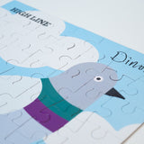 Portion of the completed Dinosaur Kids' Puzzle, showing the pigeon, the High Line logo, and "Dinosaur" in the artist's handwriting.
