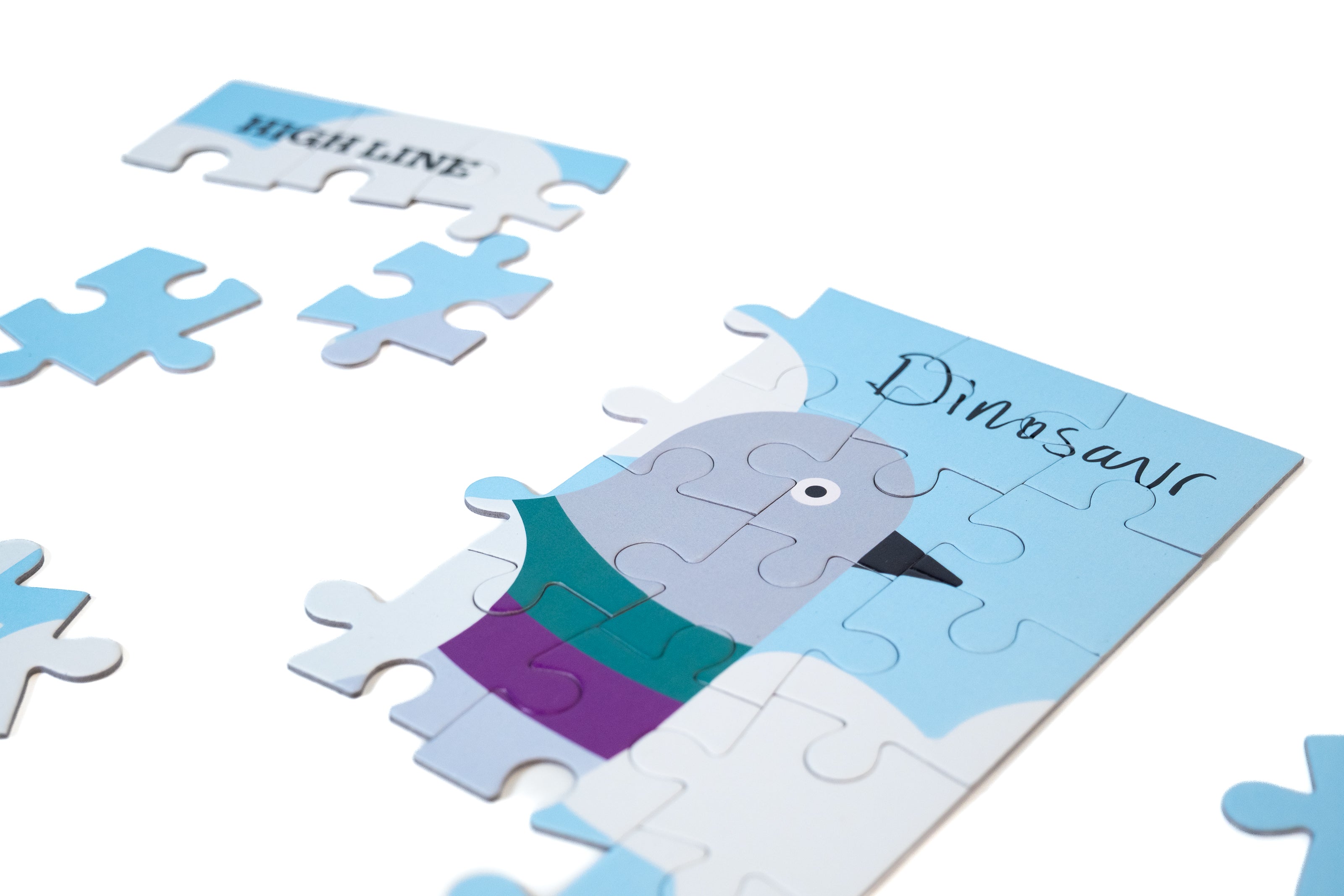 Partially completed Dinosaur Kids' Puzzle, showing some of the pigeon and "Dinosaur" in the artist's handwriting.