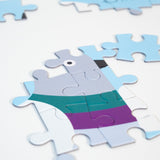 Partially completed Dinosaur Kids' Puzzle, showing some of the pigeon and "Dinosaur" in the artist's handwriting.