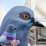 Pigeon Plush baby dinosaur with the Dinosaur statue.