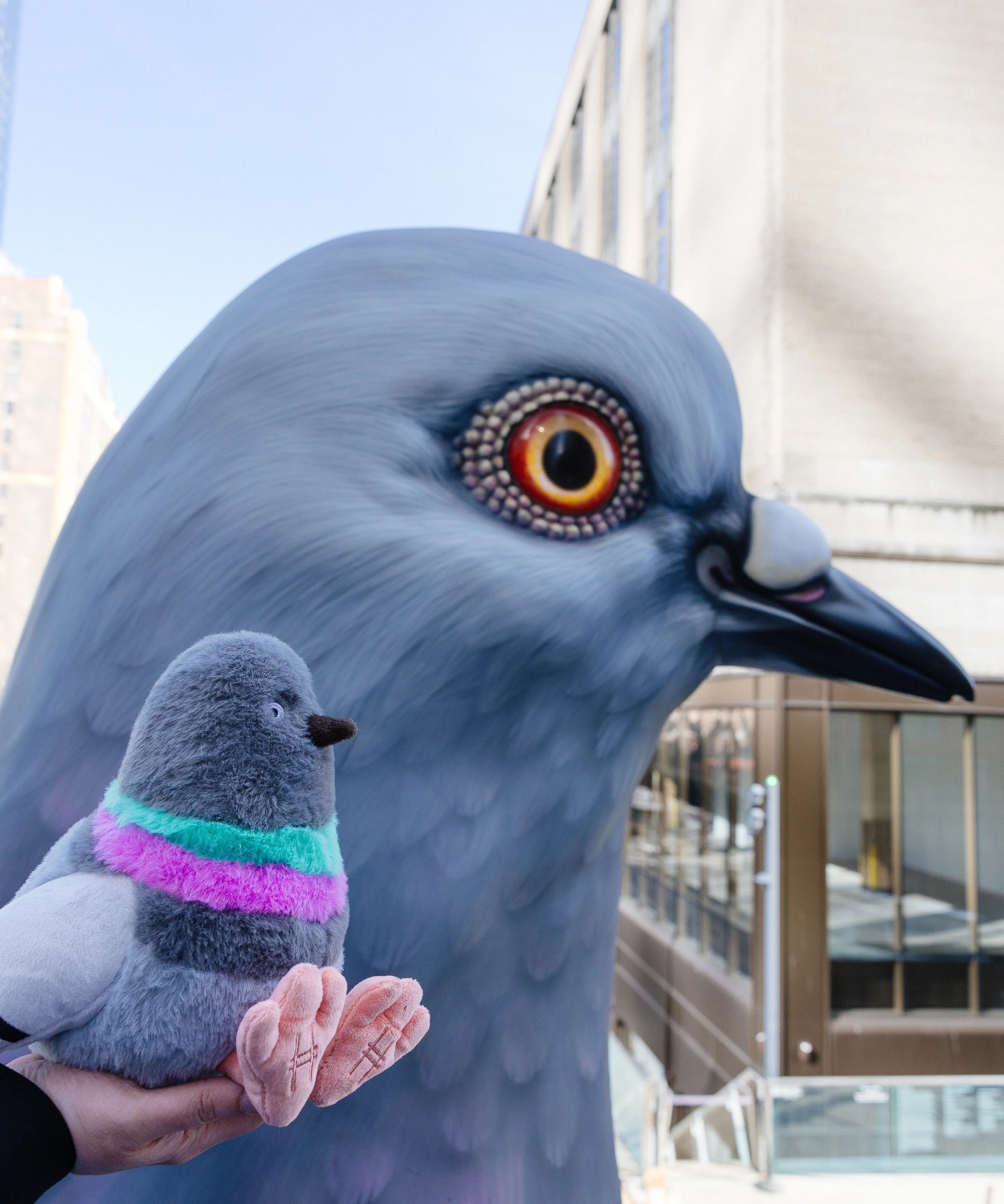 Pigeon Plush baby dinosaur with the Dinosaur statue.