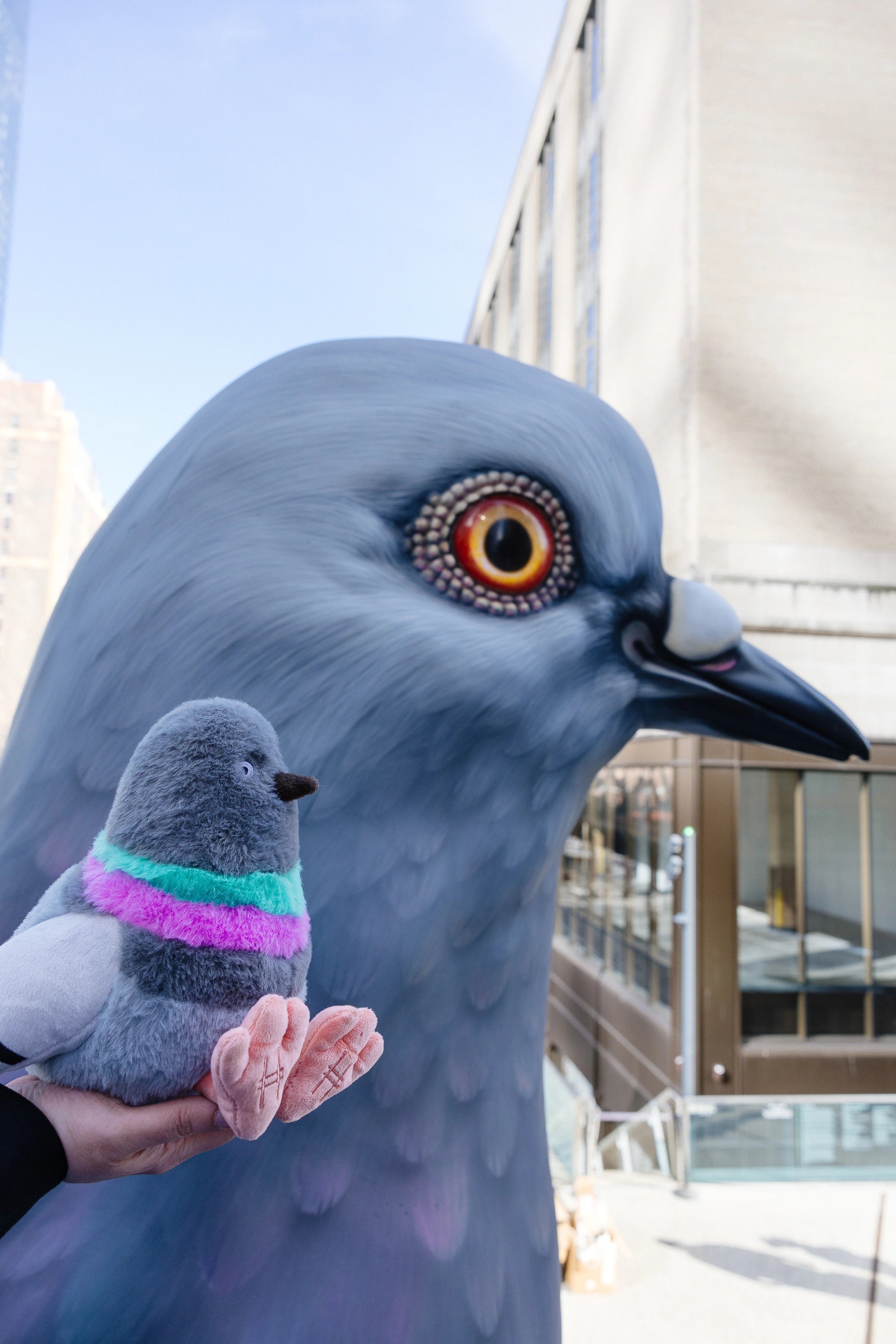 Pigeon Plush baby dinosaur with the Dinosaur statue.