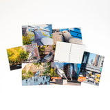Dinosaur Postcard Set—8 postcards scattered, each with their own shot of the iconic big pigeon.