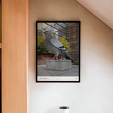 Dinosaur poster, featuring a photo of the 21-foot high Dinosaur statue aka the big pigeon, shown framed on a wall.