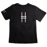 A black short-sleeve crewneck t-shirt featuring the High Line icon printed on the center chest, with white text on the left sleeve that reads "High Line. Park in the Sky. New York NY"