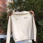 Man holding up High Line Crewneck.