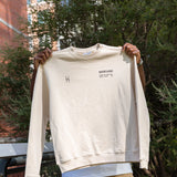 Man holding up High Line Crewneck.