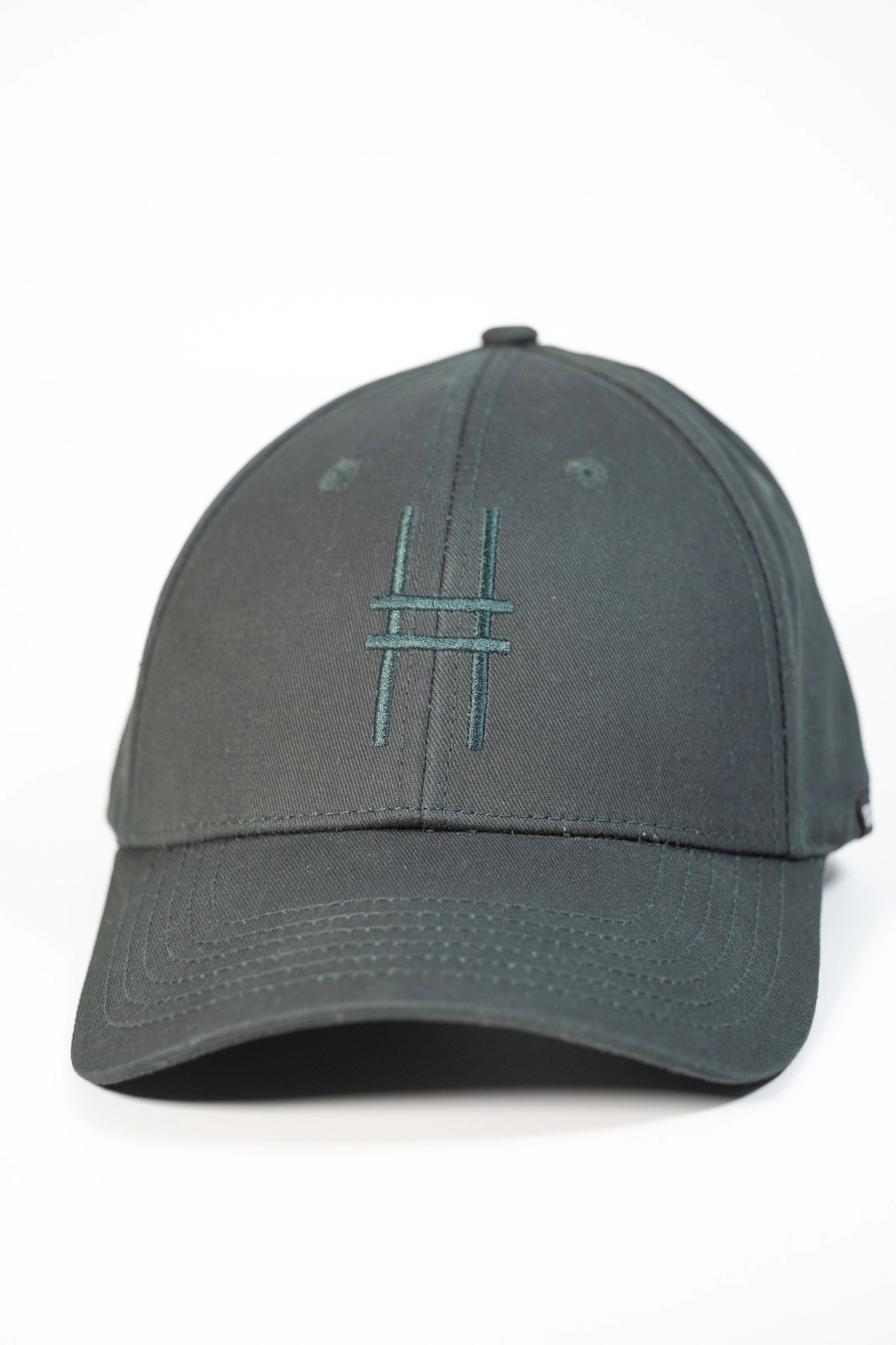 High Line Icon Cap—dark green cap with "Park in the sky" embroidered in matching text on the back.
