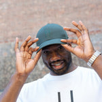 Man wearing High Line Icon Cap and Big Icon Tee in White on the High Line.