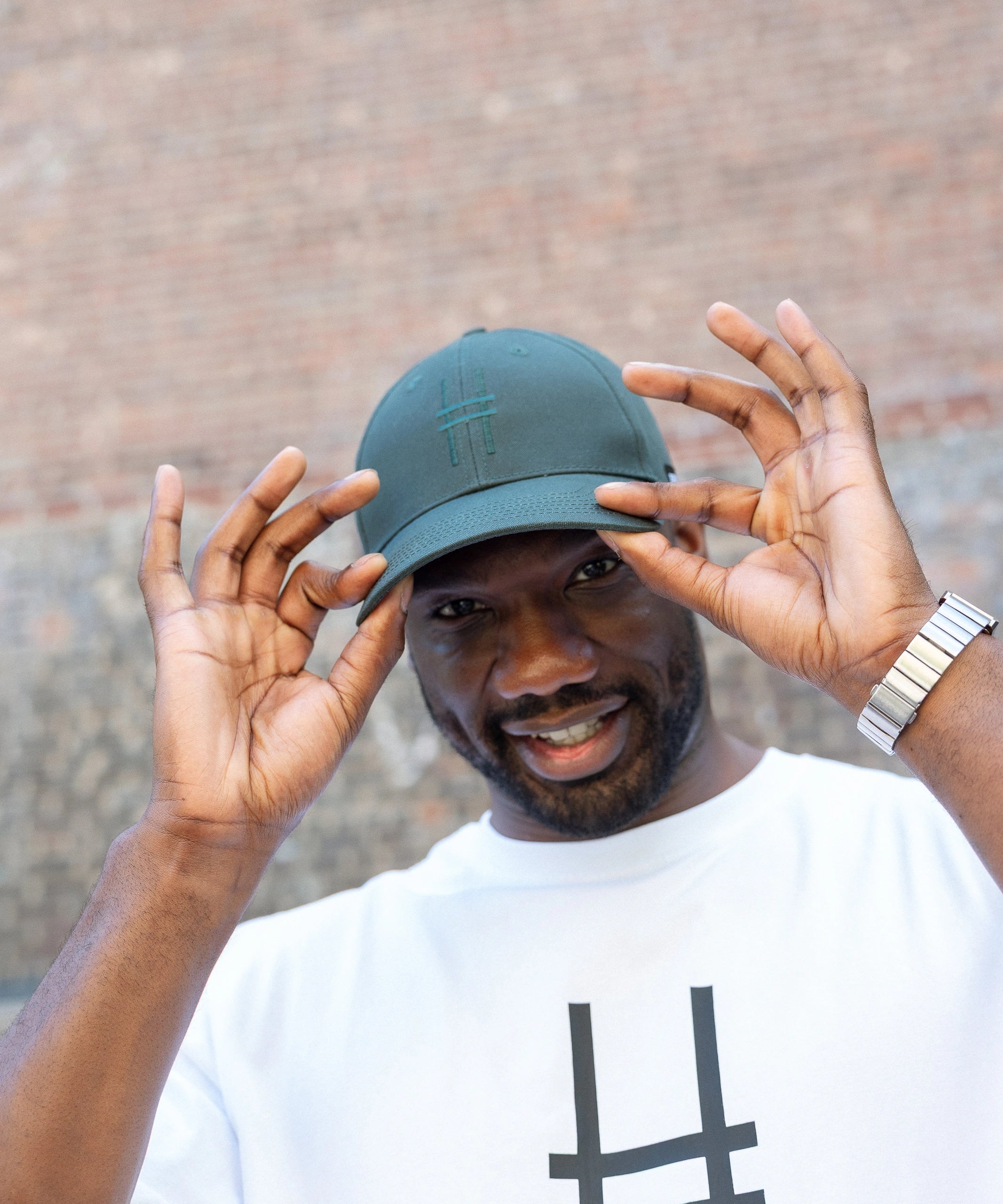 Man wearing High Line Icon Cap and Big Icon Tee in White on the High Line.