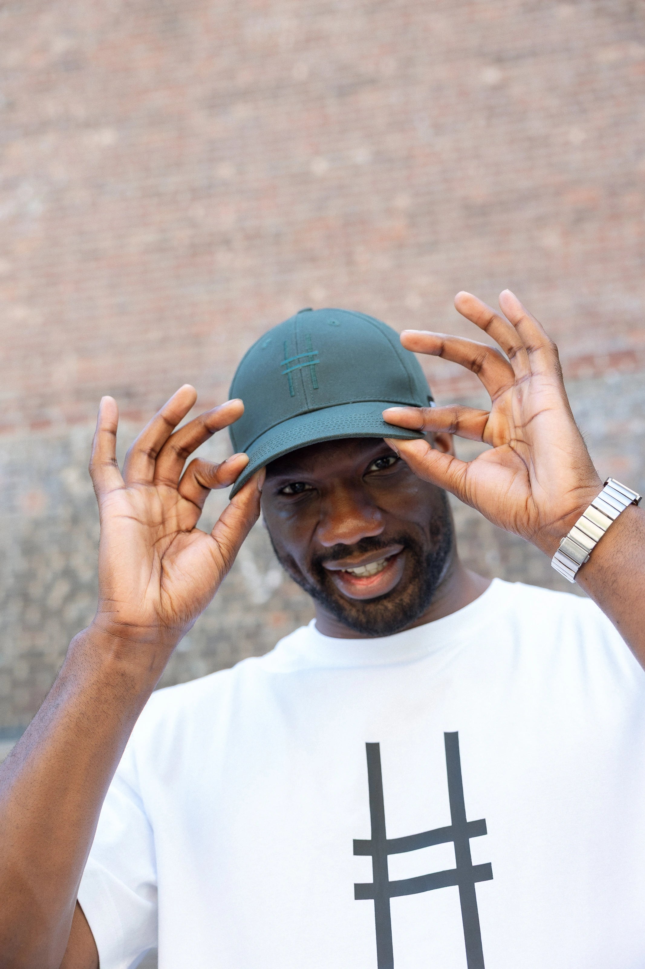 Man wearing High Line Icon Cap and Big Icon Tee in White on the High Line.