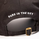 High Line Icon Contrast Cap—black cap with "Park in the sky" embroidered in white text on the back.