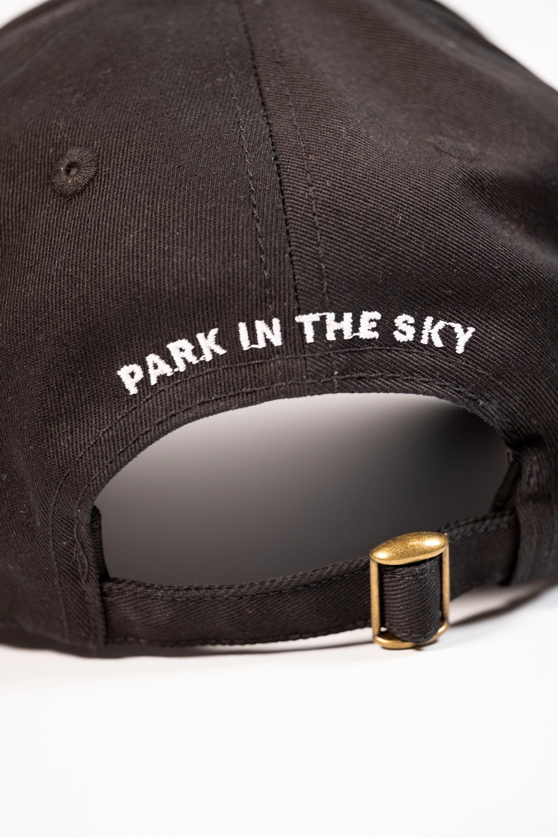 High Line Icon Contrast Cap—black cap with "Park in the sky" embroidered in white text on the back.