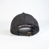 High Line Icon Contrast Cap—black cap with "Park in the sky" embroidered in white text on the back.