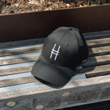 High Line Icon Contrast Cap on a bench on the High Line.