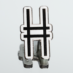 High Line Icon Enamel Pin—the High Line railroad track "H" logomark/icon in black set against white enamel—shown on a mirrored surface.