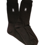 High Line Socks in Black. Black crew socks with white intarsia High Line icon on each side of each sock.
