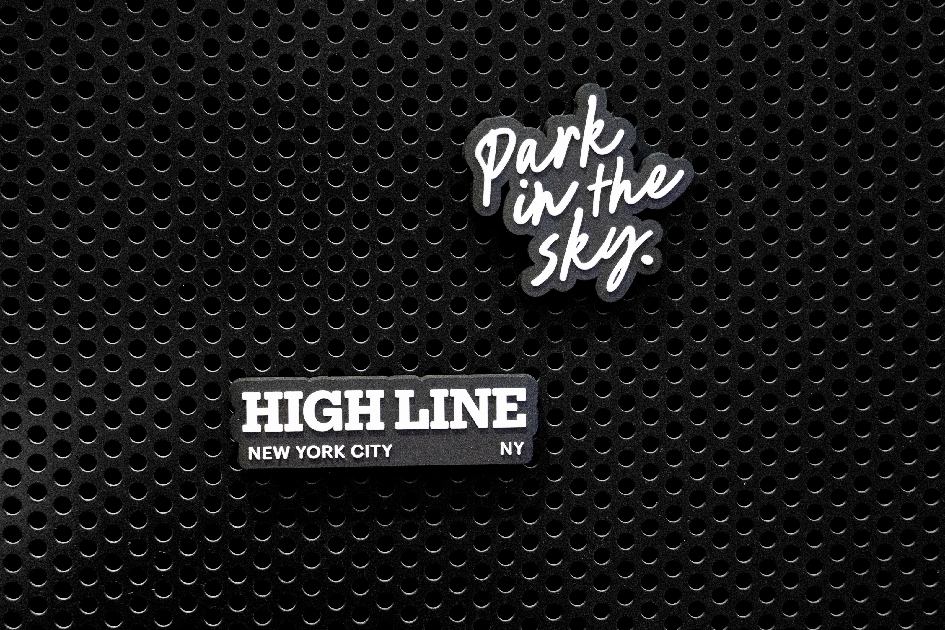 High Line Iconc collection rubber fridge magnets on a black metal locker. 