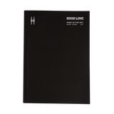High Line soft cover unlined notebook in black with white cover details. Cover features High Line icon in upper left and High Line wordmark with tagline in the upper right.