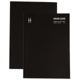 High Line soft cover unlined notebook in black with white cover details.