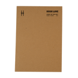 High Line soft cover unlined notebook in natural kraft with black cover details. Cover features High Line icon in upper left and High Line wordmark with tagline in the upper right.