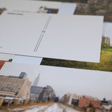 Closeup of Joel Sternfeld Postcards scattered and overlapping.