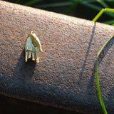 Varada mudra pendant resting on rail track