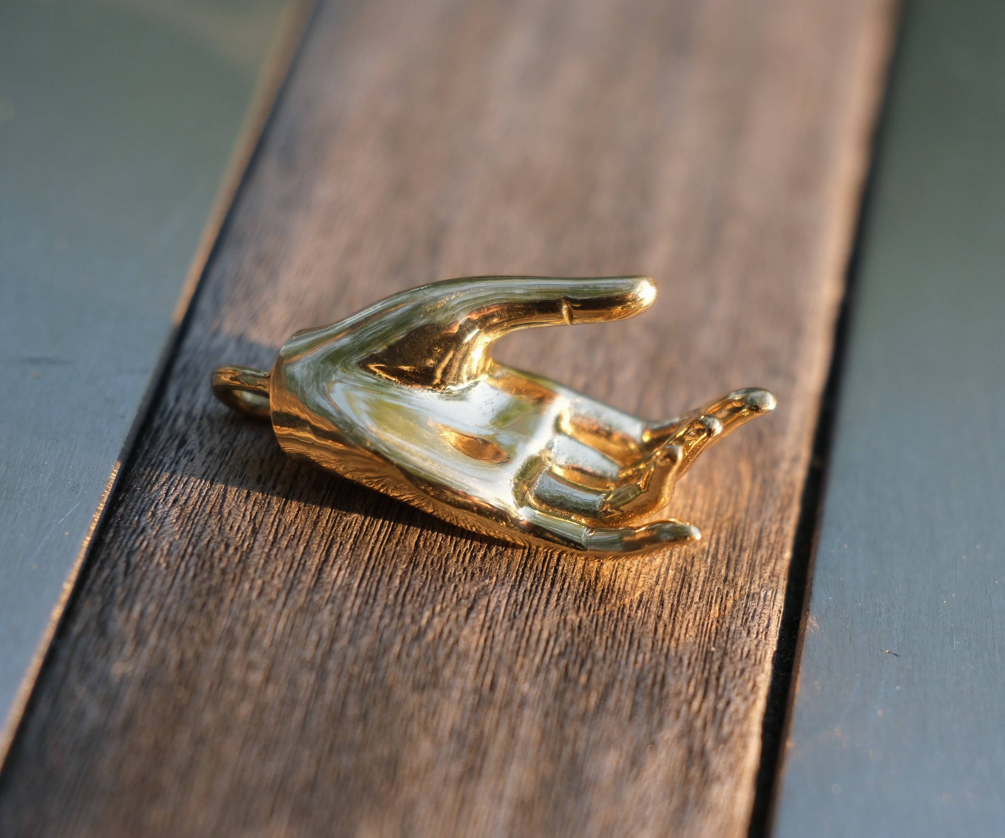 Varada mudra pendant in closeup.