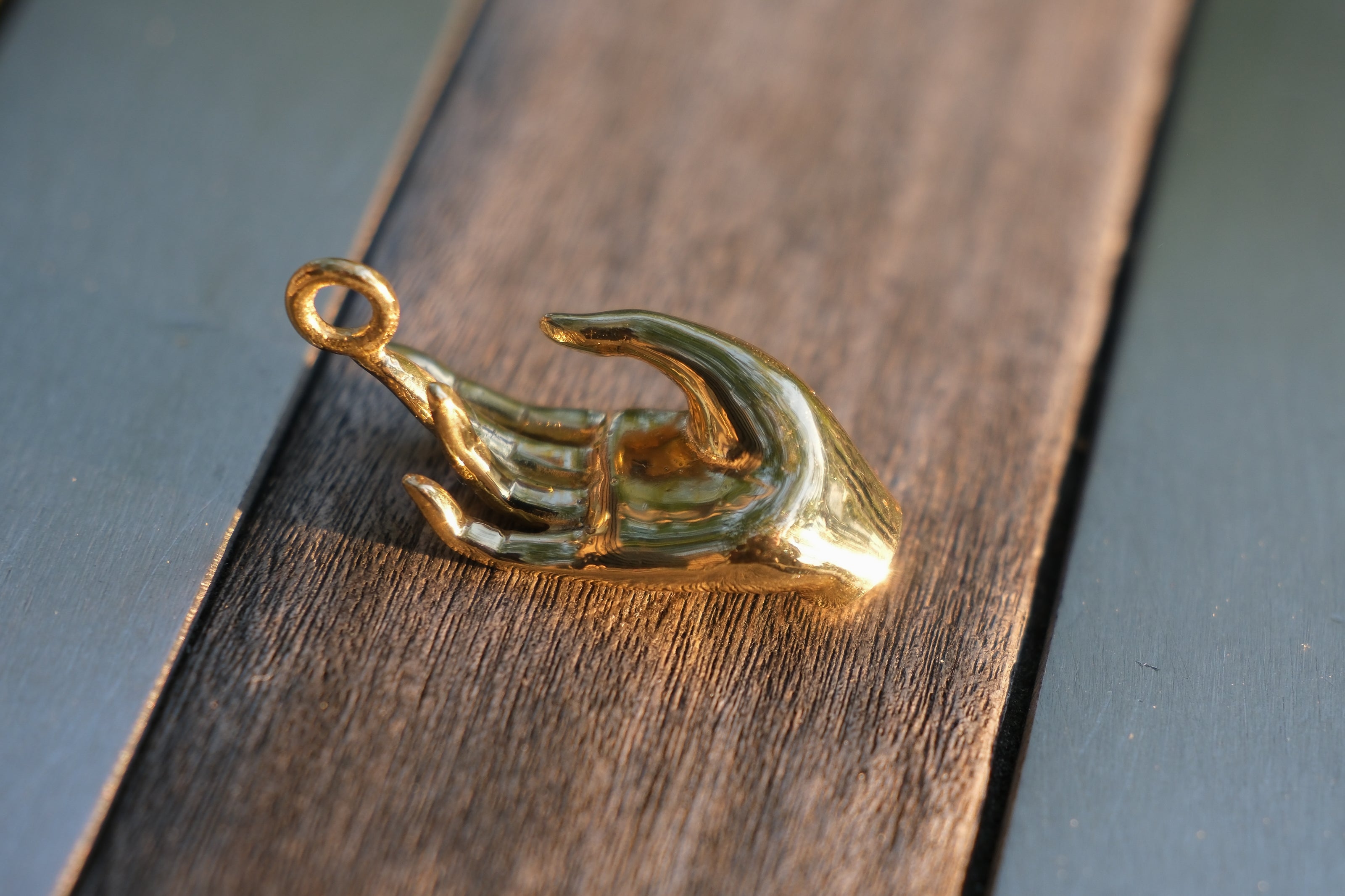 Abhaya mudra pendant in closeup