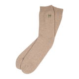 Lingua Franca x High Line 100% Cashmere Socks. These oatmeal colored socks are embroidered with the High Line icon in green just below the outer cuff of each sock.
