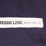 Park in the Sky Crewneck in navy. Close up of chest ribbon detail with the High Line wordmark and "New York NY"